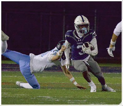 A football player running on the field. Description generated by AI