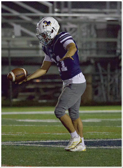 A football player wearing a blue jersey with the number 58 on it. Description generated by AI