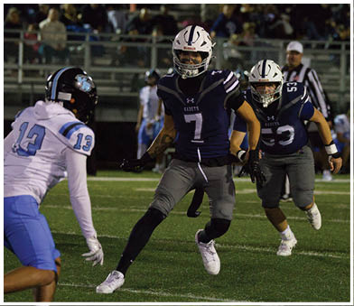 A football player running on the field. Description generated by AI
