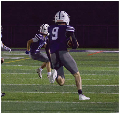 A football player running on the field. Description generated by AI
