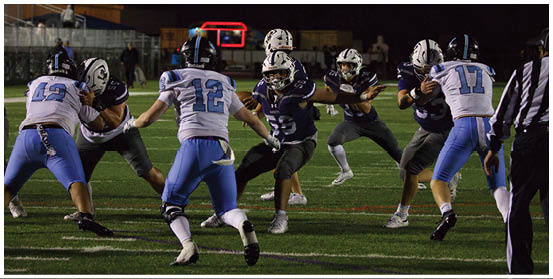 A football player is sliding on the ground. Description generated by AI