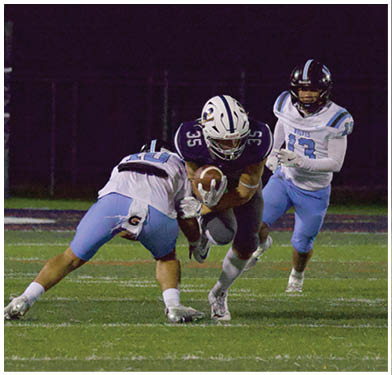 A football player running on the field. Description generated by AI