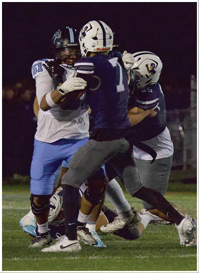 A football player wearing a blue jersey with the number 58 on it. Description generated by AI