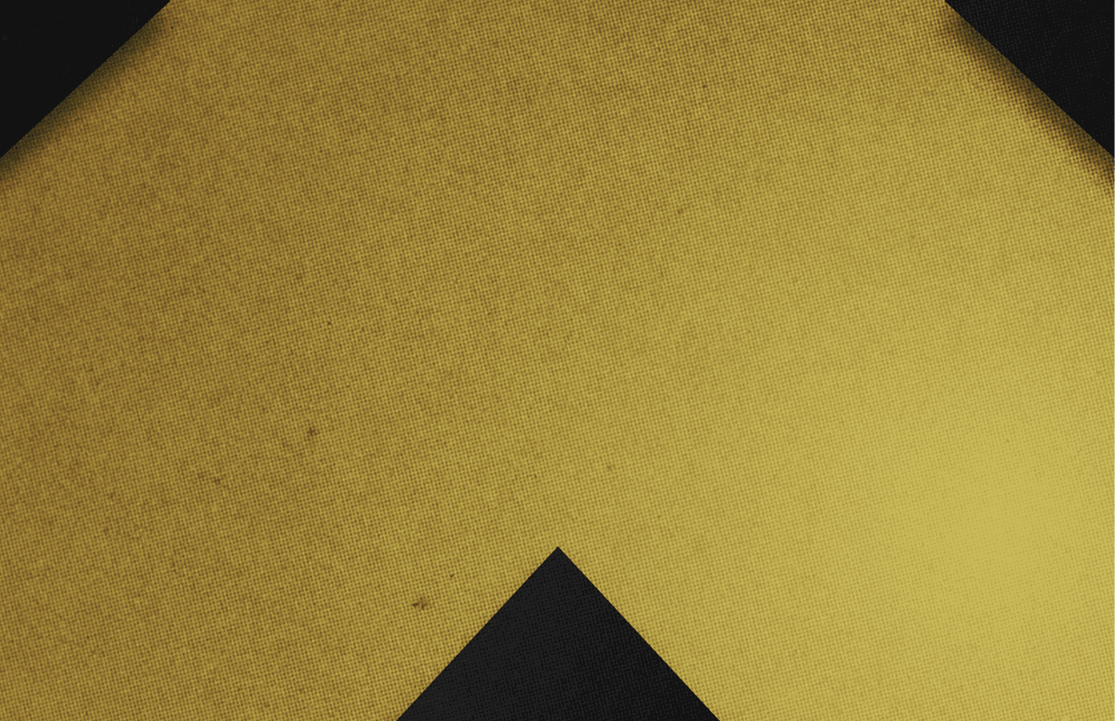 A red and black triangle. Description generated by AI
