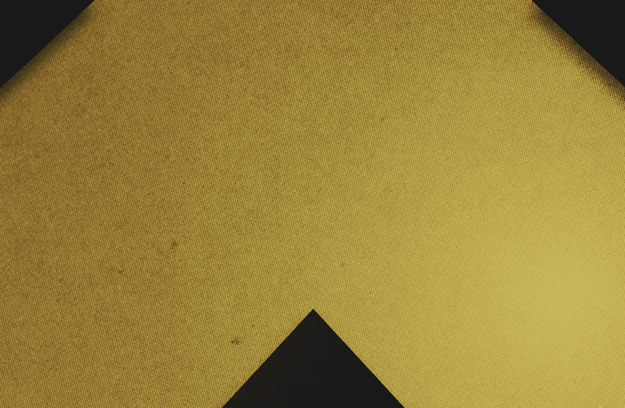 A red and black triangle. Description generated by AI