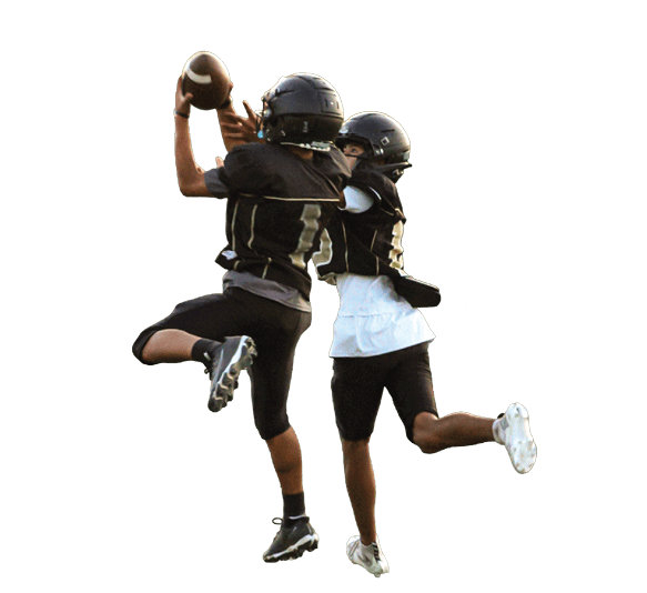 Two people in football uniforms are actively engaged in catching a football on a field during a game or practice. Description generated by AI