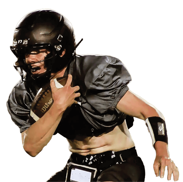 A person wearing black athletic shorts, black socks, and cleats is in a wide stance, possibly preparing to engage in a sports activity. Description generated by AI