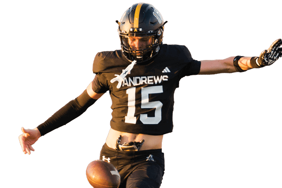 A person wearing a black football uniform with the number 15 is kicking a football mid-air. Description generated by AI