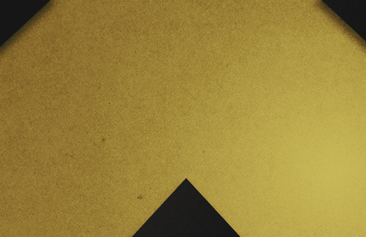A red and black triangle. Description generated by AI
