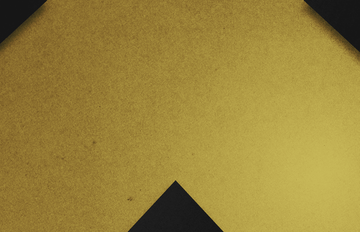 A red and black triangle. Description generated by AI