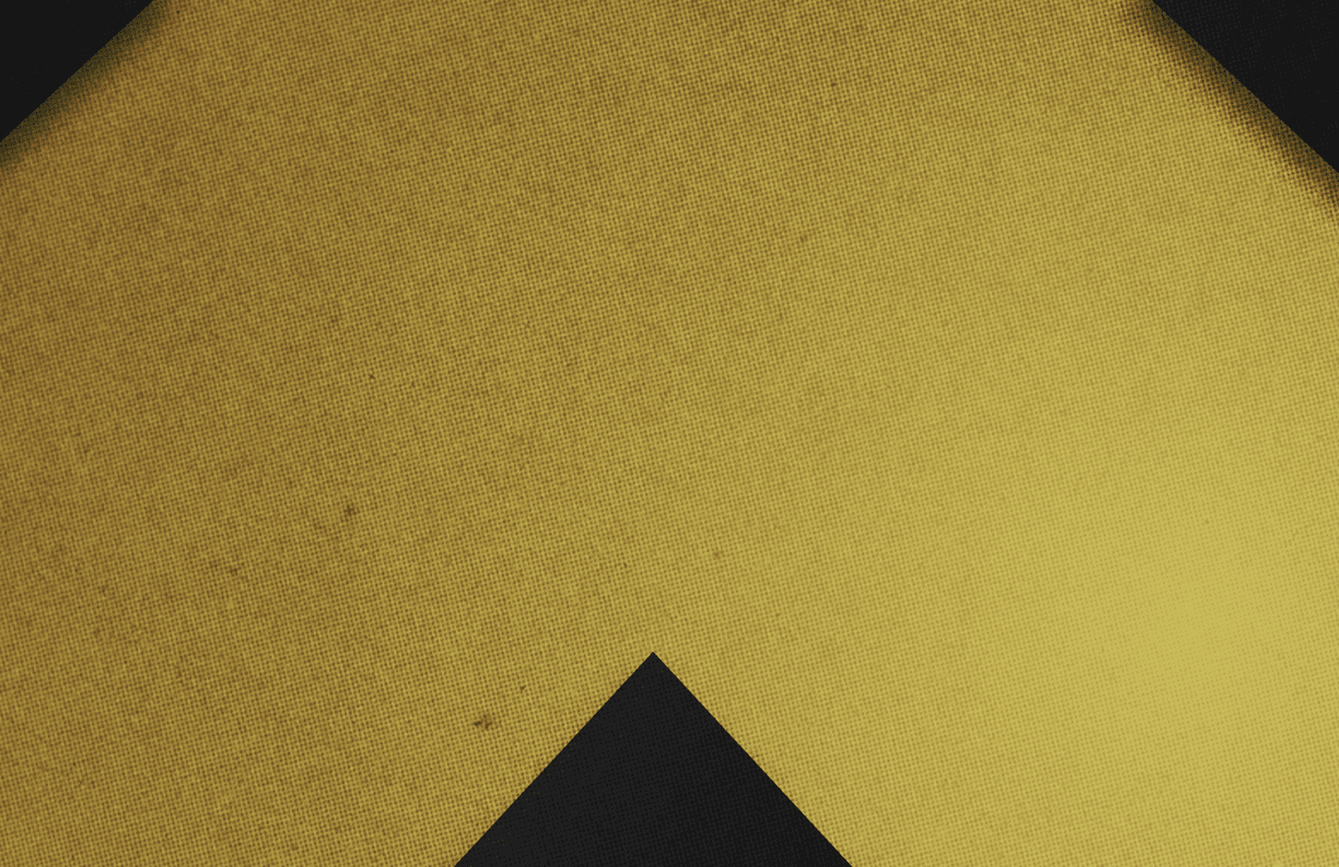 A red and black triangle. Description generated by AI