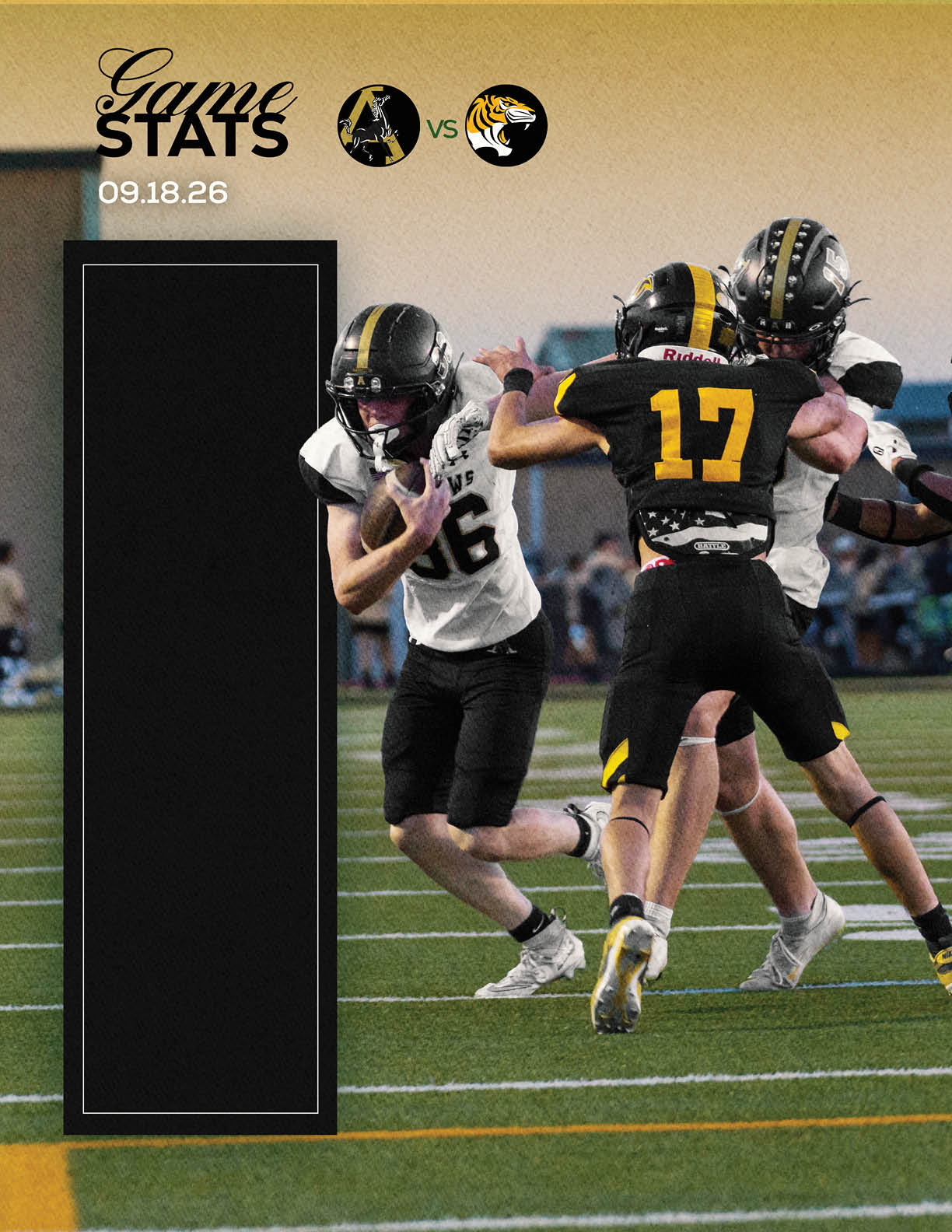 Two people in black and yellow sports uniforms are engaged in a football game against two people in white and black uniforms on a field with yard lines. Description generated by AI