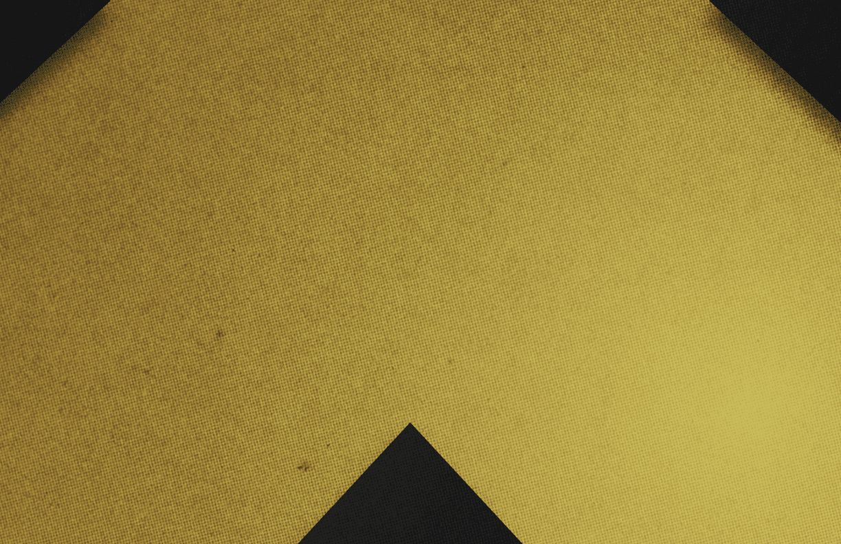 A red and black triangle. Description generated by AI