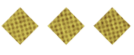 Three diamond-shaped waffle pieces with a golden-brown color and grid pattern are arranged in a row on a white background. Description generated by AI