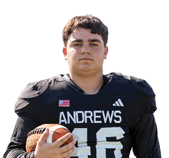 A person wearing a black football jersey with the name Andrews and holding a football is standing against a white background. Description generated by AI