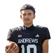 A person wearing a black football jersey with the name Andrews and number 10 is holding a football. Description generated by AI