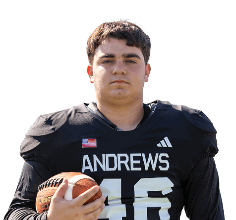 A person wearing a black football jersey with the name Andrews and holding a football is standing against a white background. Description generated by AI