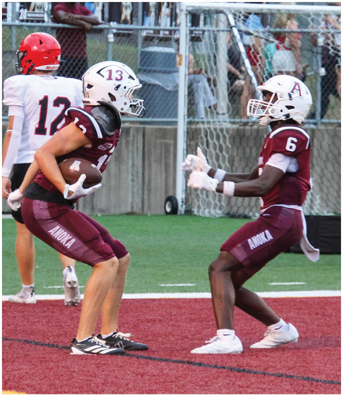 A group of football players on a field. Description generated by AI