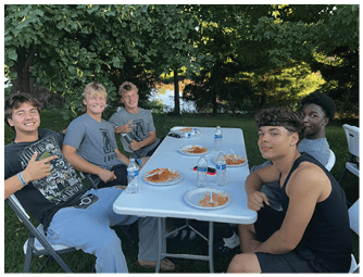 A group of football players on a field. Description generated by AI