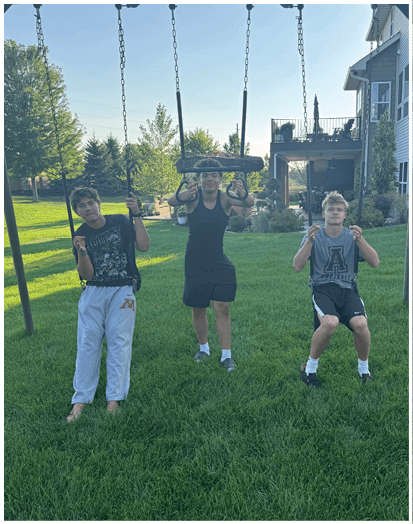 A group of football players on a field. Description generated by AI