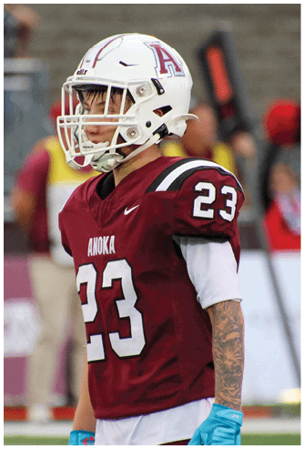 A group of football players celebrating a touchdown. Description generated by AI