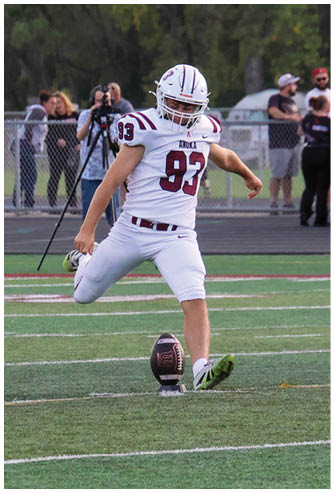 A group of football players celebrating a touchdown. Description generated by AI