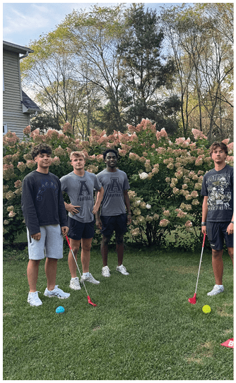 A football player catching a ball. Description generated by AI