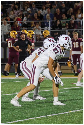 A group of football players celebrating a touchdown. Description generated by AI