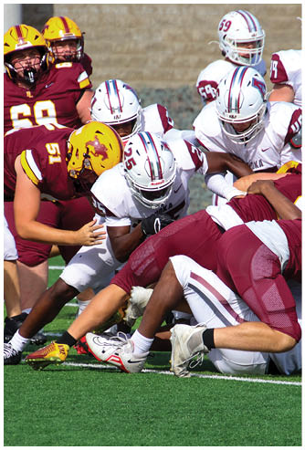 A football game is being played on a field. Description generated by AI