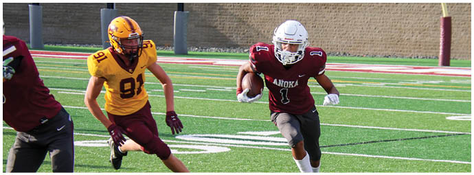 A football player wearing a blue and white uniform. Description generated by AI