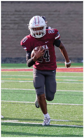 A football player catching a ball. Description generated by AI