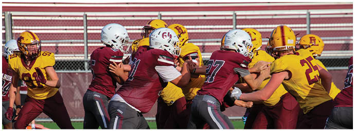 A football player wearing a blue and white uniform. Description generated by AI