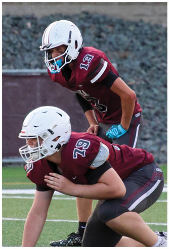 A football game is being played on a field. Description generated by AI