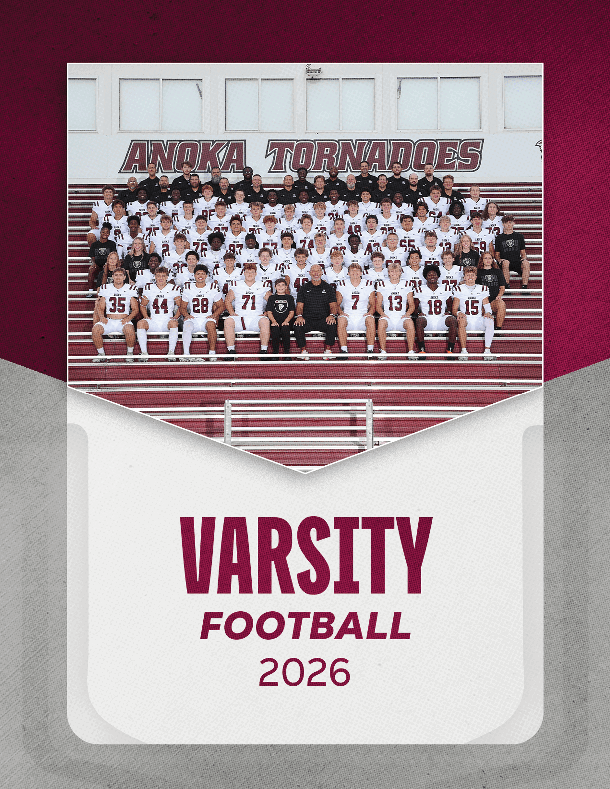 A group of football players sitting on a bench. Description generated by AI