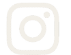 A simple gray Instagram logo with a rounded square outline, a circle in the center, and a smaller circle in the top right corner. Description generated by AI