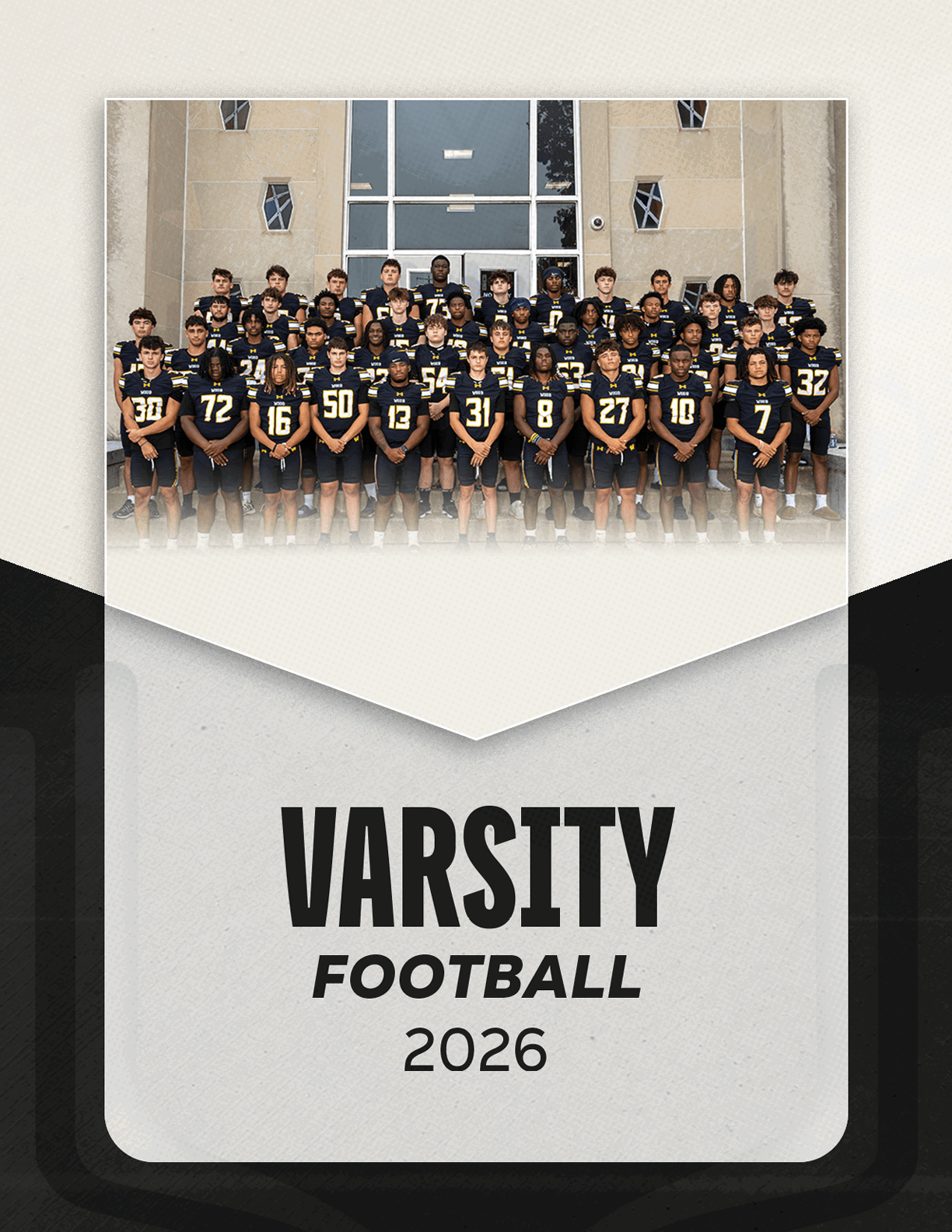 A group of people wearing matching dark sports uniforms with numbers pose in front of a building above the text varsity football 2026. Description generated by AI