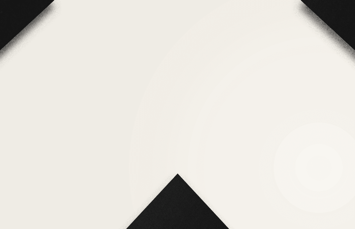 A close-up of a black and white geometric pattern forming a downward-pointing arrow shape. Description generated by AI