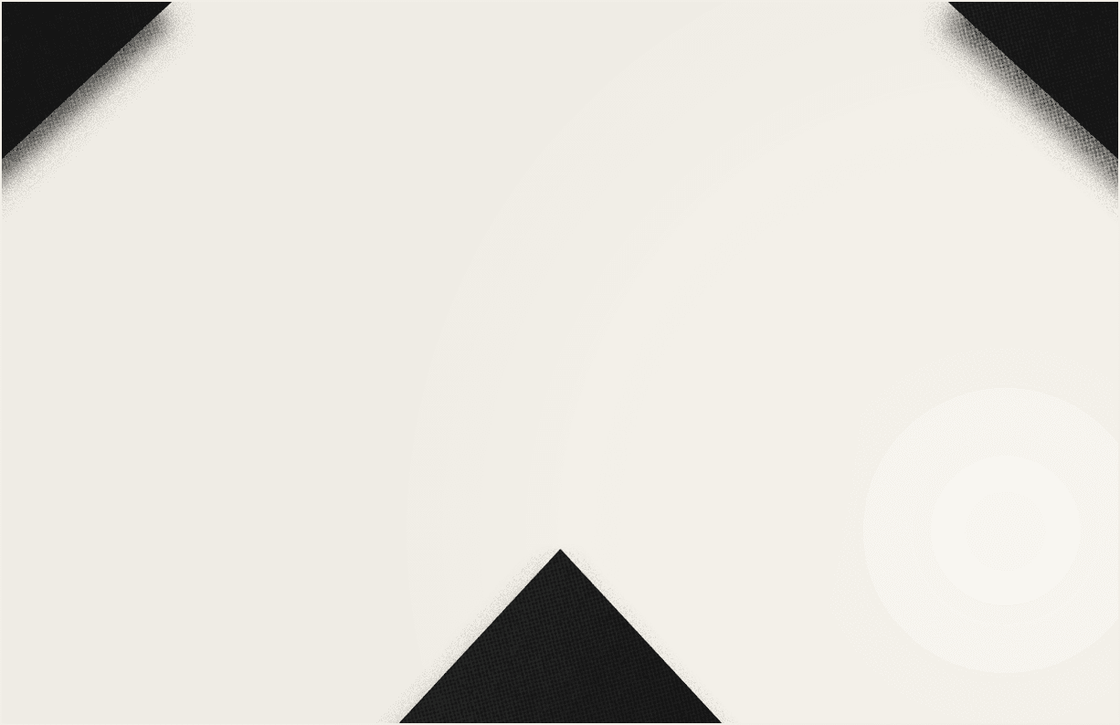 A close-up of a black and white geometric pattern forming a downward-pointing arrow shape. Description generated by AI