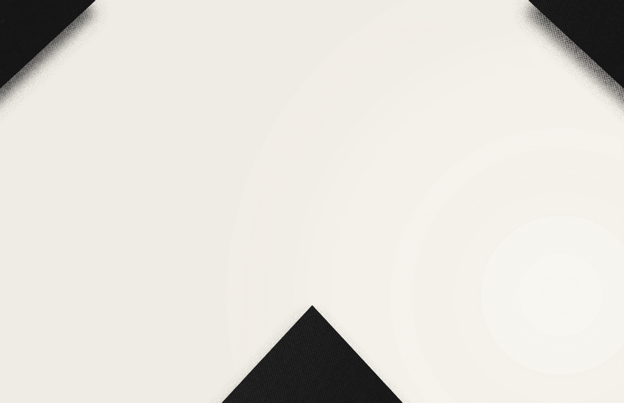 A close-up of a black and white geometric pattern forming a downward-pointing arrow shape. Description generated by AI