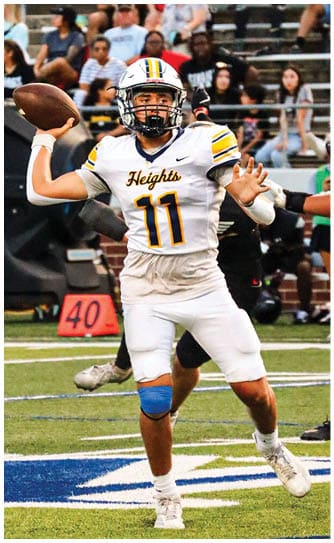 A football player catching a ball. Description generated by AI