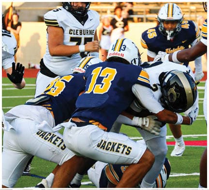 A football player running on the field. Description generated by AI