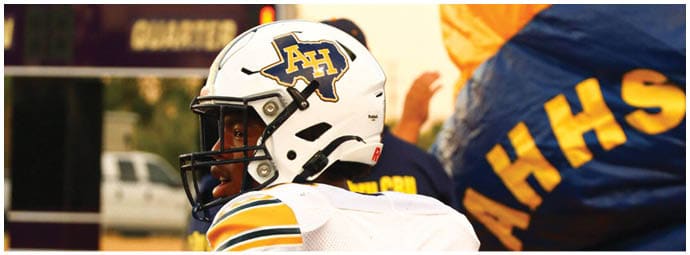 A football player wearing a blue and white uniform. Description generated by AI