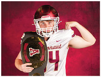 A person wearing a football helmet and jersey flexes their arm while holding a championship belt against a red background. Description generated by AI