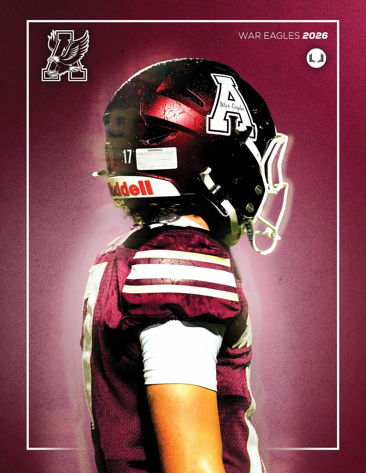A person wearing a maroon football uniform and helmet with a large letter A on the side stands in profile against a maroon background with the text War Eagles 2026. Description generated by AI