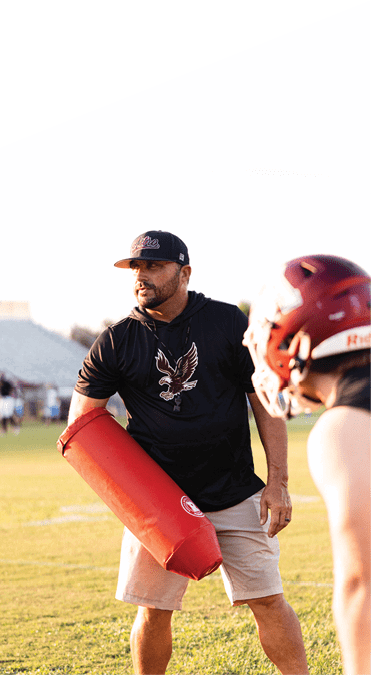 Two young men wearing football uniforms and making hand gestures. AI generated content