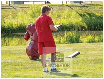 A group of football players on a field. Description generated by AI