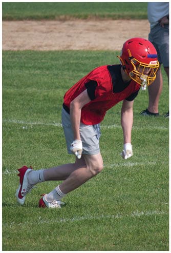 A football game is being played on a field. Description generated by AI