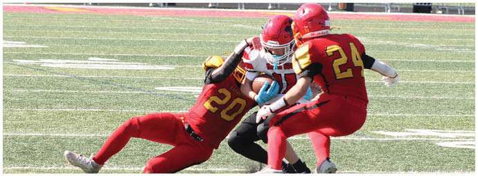 A football player wearing a blue and white uniform. Description generated by AI