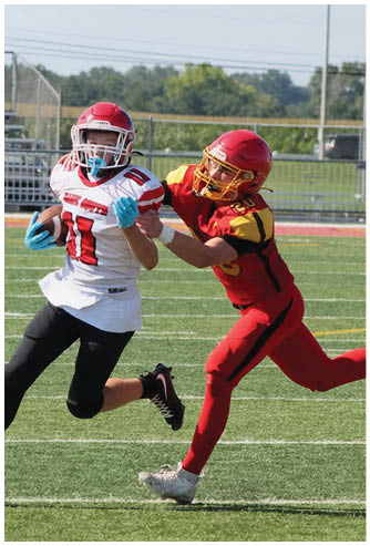 A football game is being played on a field. Description generated by AI
