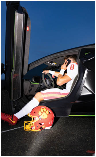 A football player catching a ball. Description generated by AI